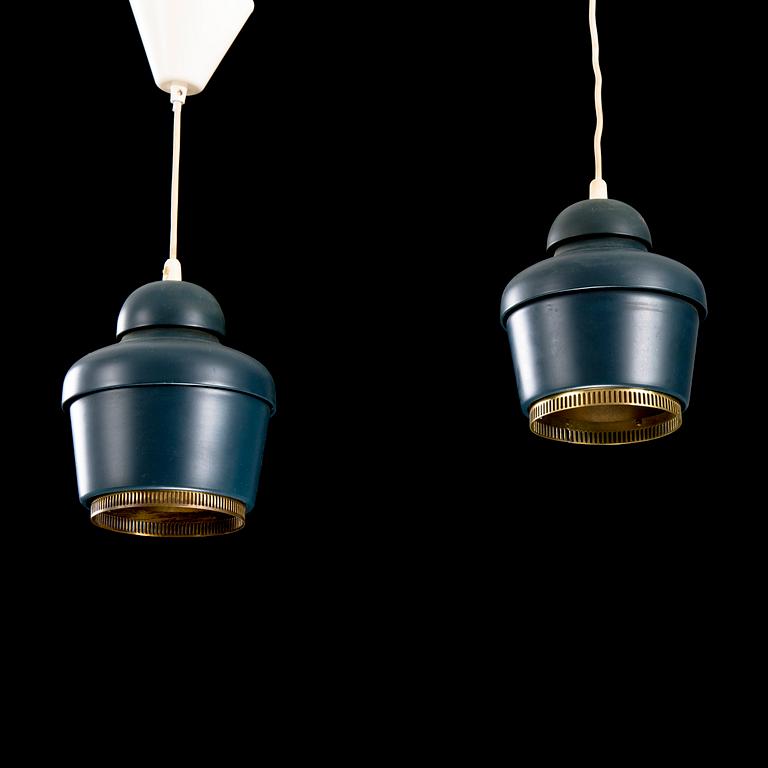 A pair of 'A330' ceiling lamps for Valaistustyö.