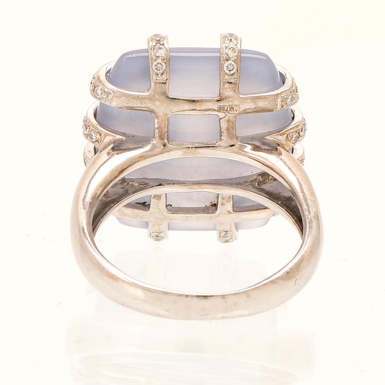 An 18K white gold ring with brilliant cut diamonds and possibly chalcedony.