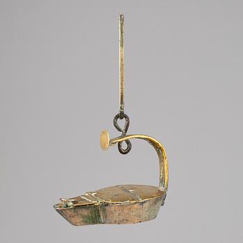 An 18th century bronze oil lamp.