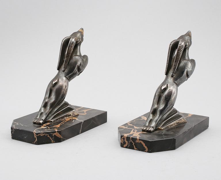 BOKSTÖD, 1 par, patinerad metall, signerade H Moreau, 1900-talets första hälft.