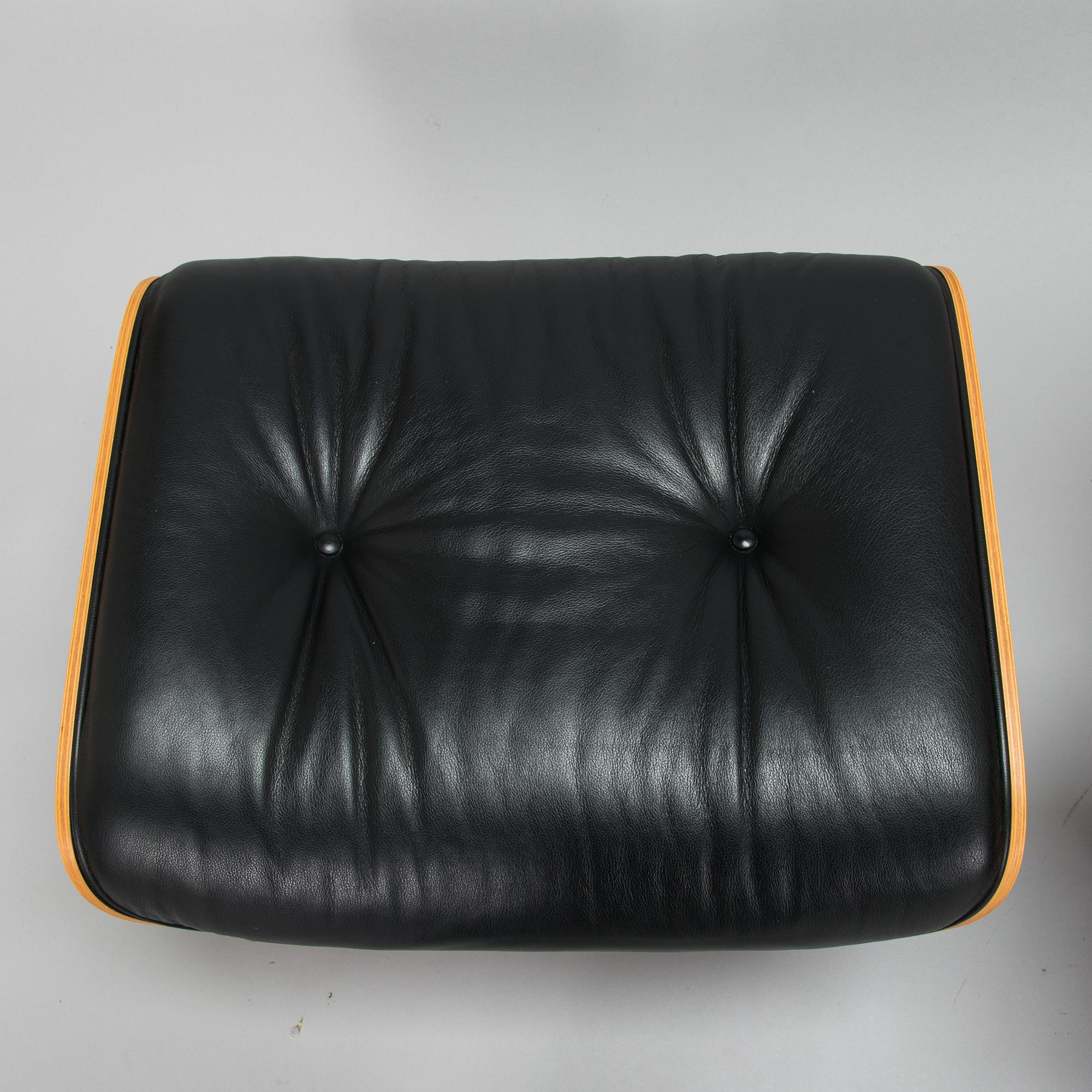 Charles and Ray Eames, a 'Lounge chair' and stool for Vitra 2006.