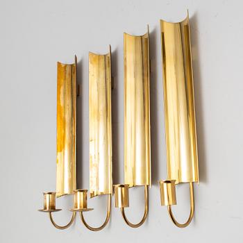 A set of four 'Reflex' brass wall scones by Pierre Forsell, Skultuna.