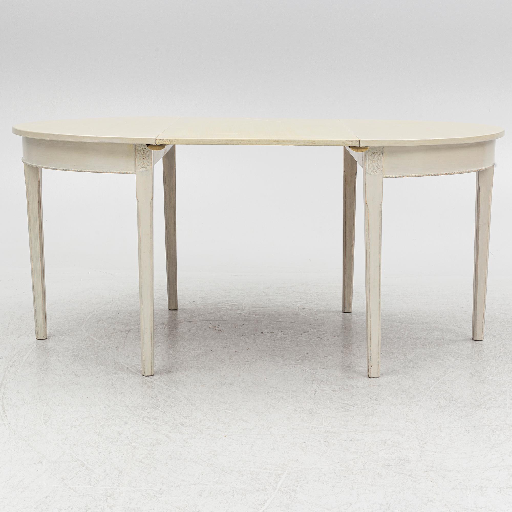 A Gustaivan style dining table/ two crescent shaped tables, end of the 19th century.