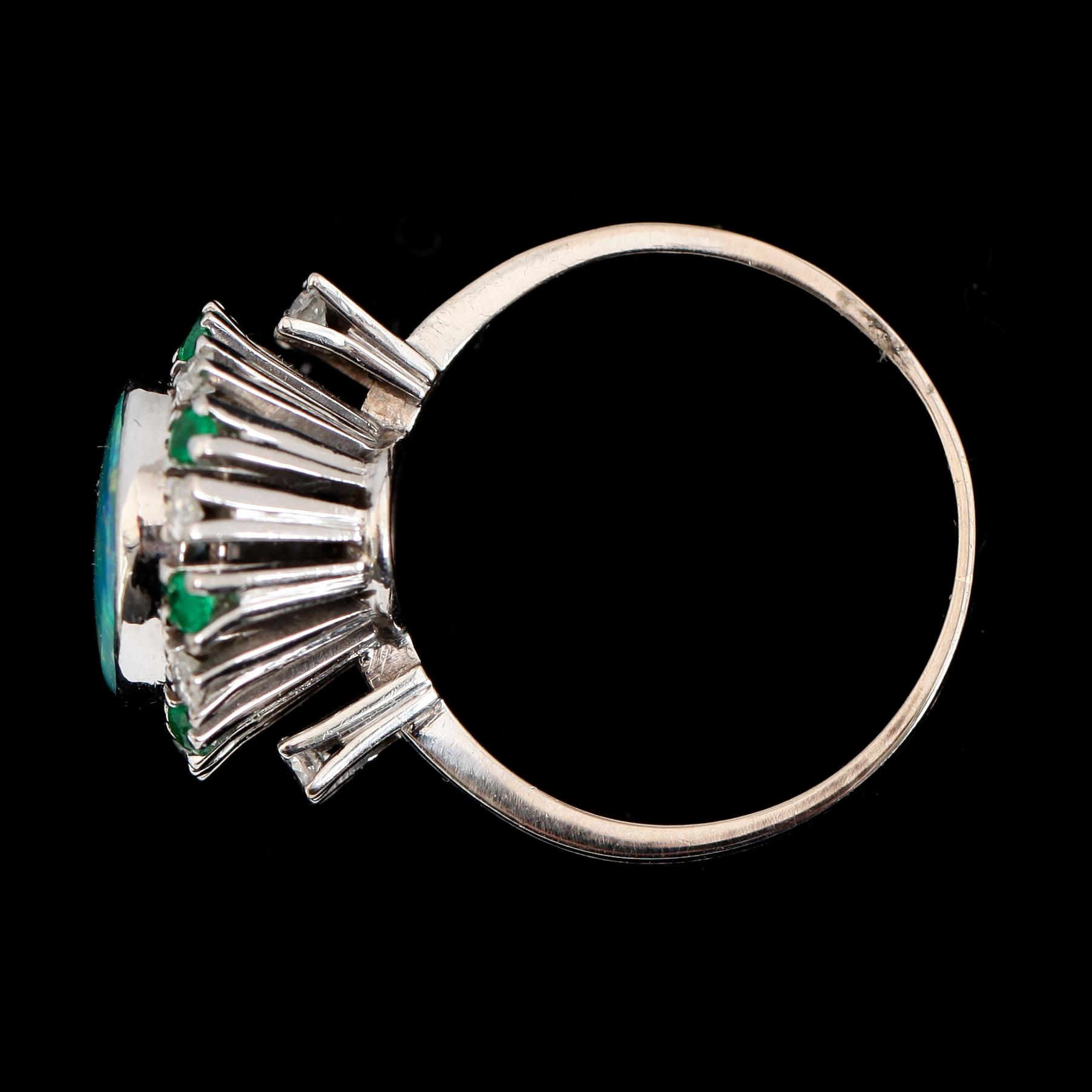 RING, 18K vitguld, opal, briljantslipade diamanter och smaragder.
