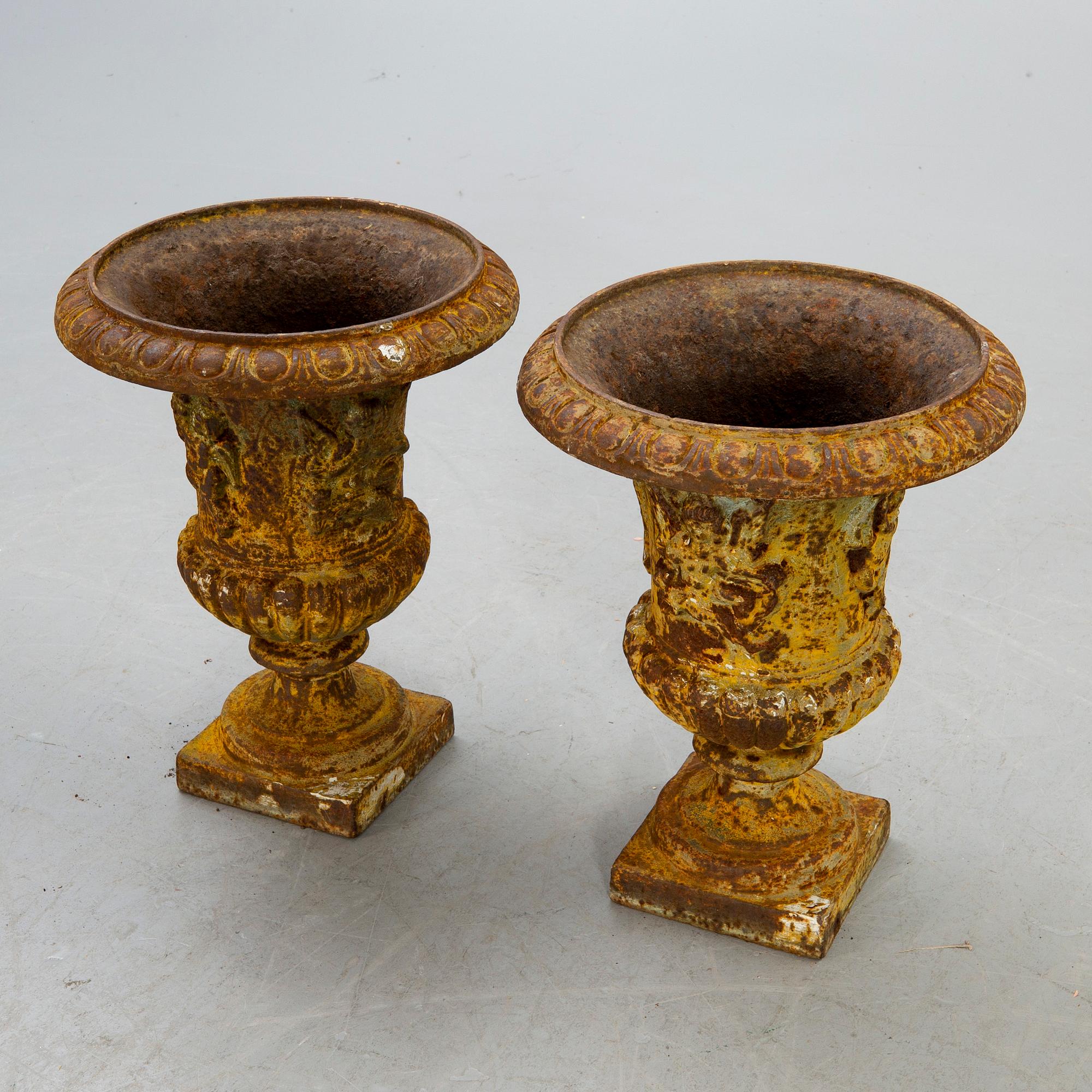 A pair of cast iron garden urns fist half of the 20th century.