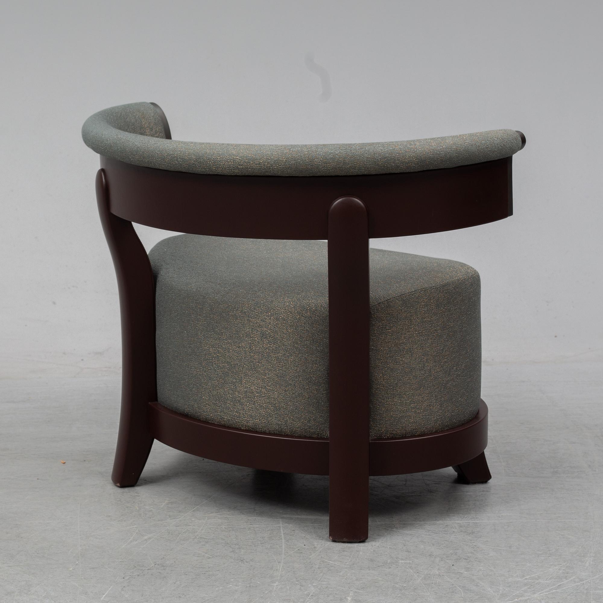 A contemporary 'Chelsea' armchair by Romeo Sozzi for Promemoria Furniture.