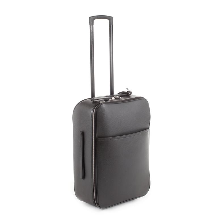 LOUIS VUITTON, a black leather suitcase, "Pegase".