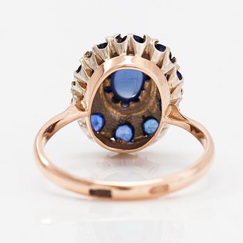 A 14K gold ring with a cabochon-cut synthetic sapphire and real sapphires. Yerevan.