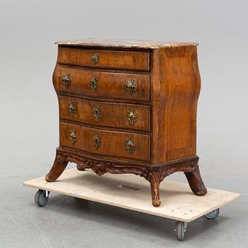A 19th Century rococo style chest of drawers.