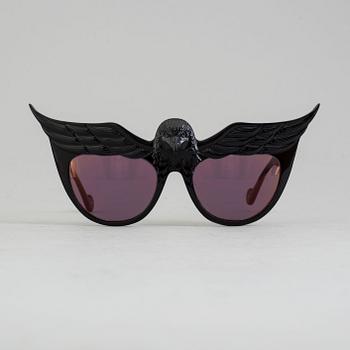 A pair of Anna-Karin Karlsson sunglasses.