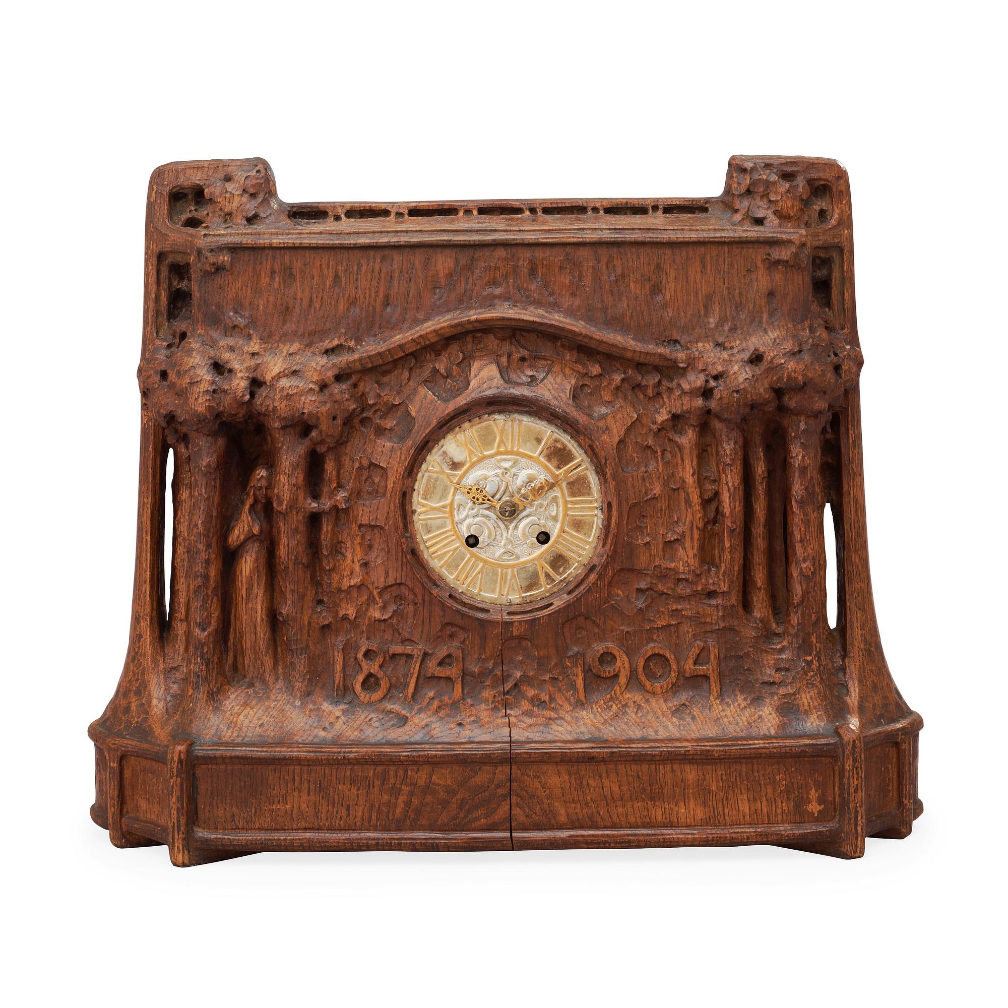 A Swedish Art Nouveau carved pine mantel clock, probably by Rackengruppen.