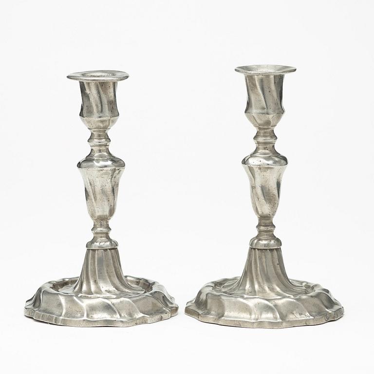 A pair of Swedish Rococo pewter candlesticks by L Lundwall 1762.