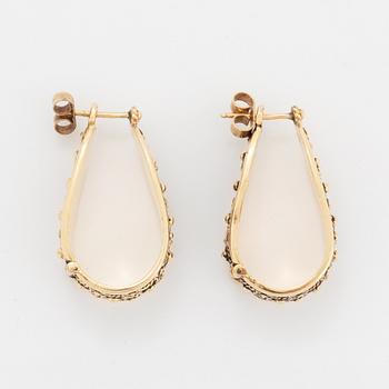 14K gold hoop earrings.