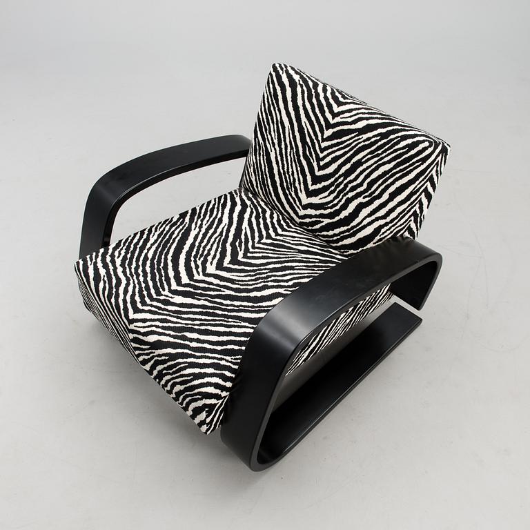 An armchair no 400, designed in 1936.