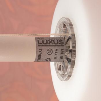 A white metal floor lights, Luxus, Vittsjö.