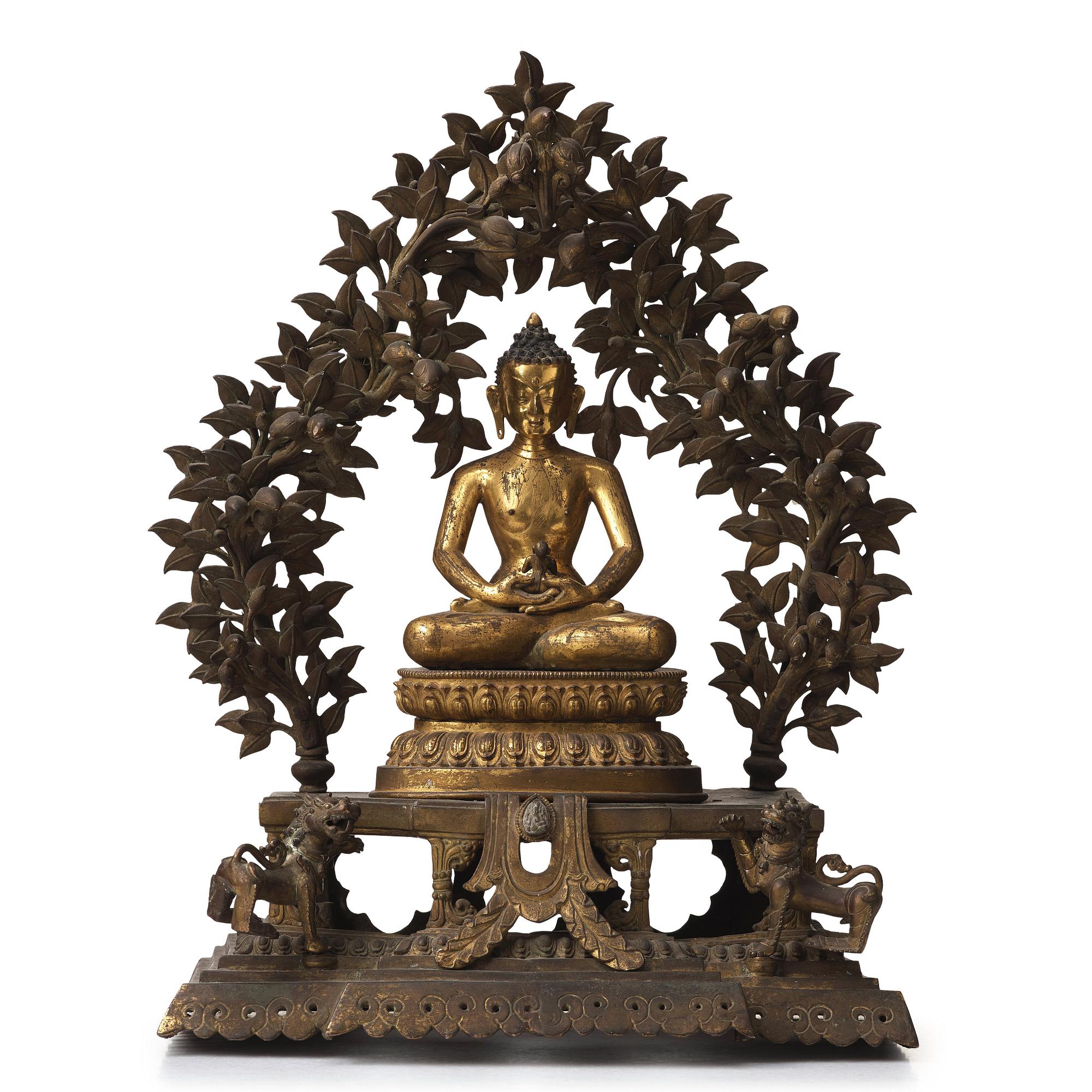 A large Nepalese gilt bronze buddha on a throne with mandorla, 18/19th Century.