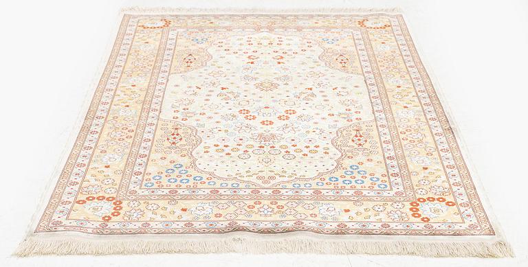 A double-nisch silk Hereke rug, c. 125 x 78 cm.