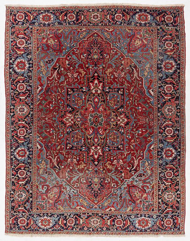 An Antique Heriz carpet, North west persia, c. 380 x 310 cm.