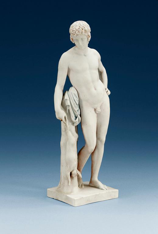 A Royal Copenhagen bisquit figure of a young man, 19th Century.