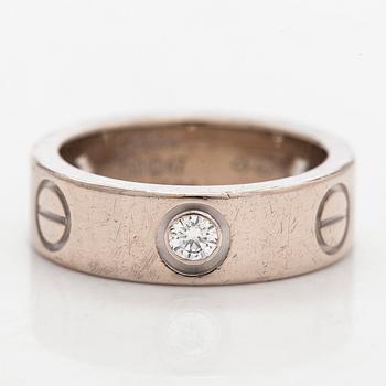 Cartier, an 18K white gold 'Love' ring with three brilliant-cut diamonds.