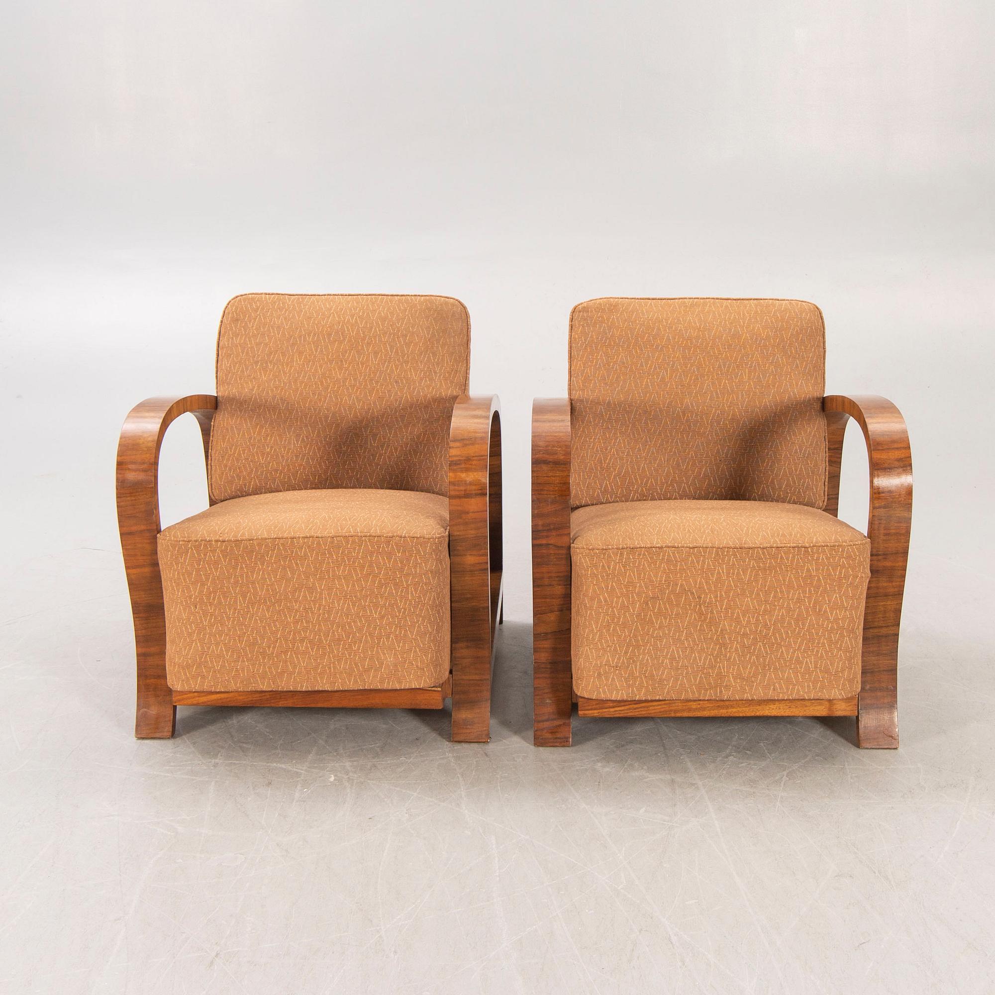 A pair of Art Deco walnut armchairs.