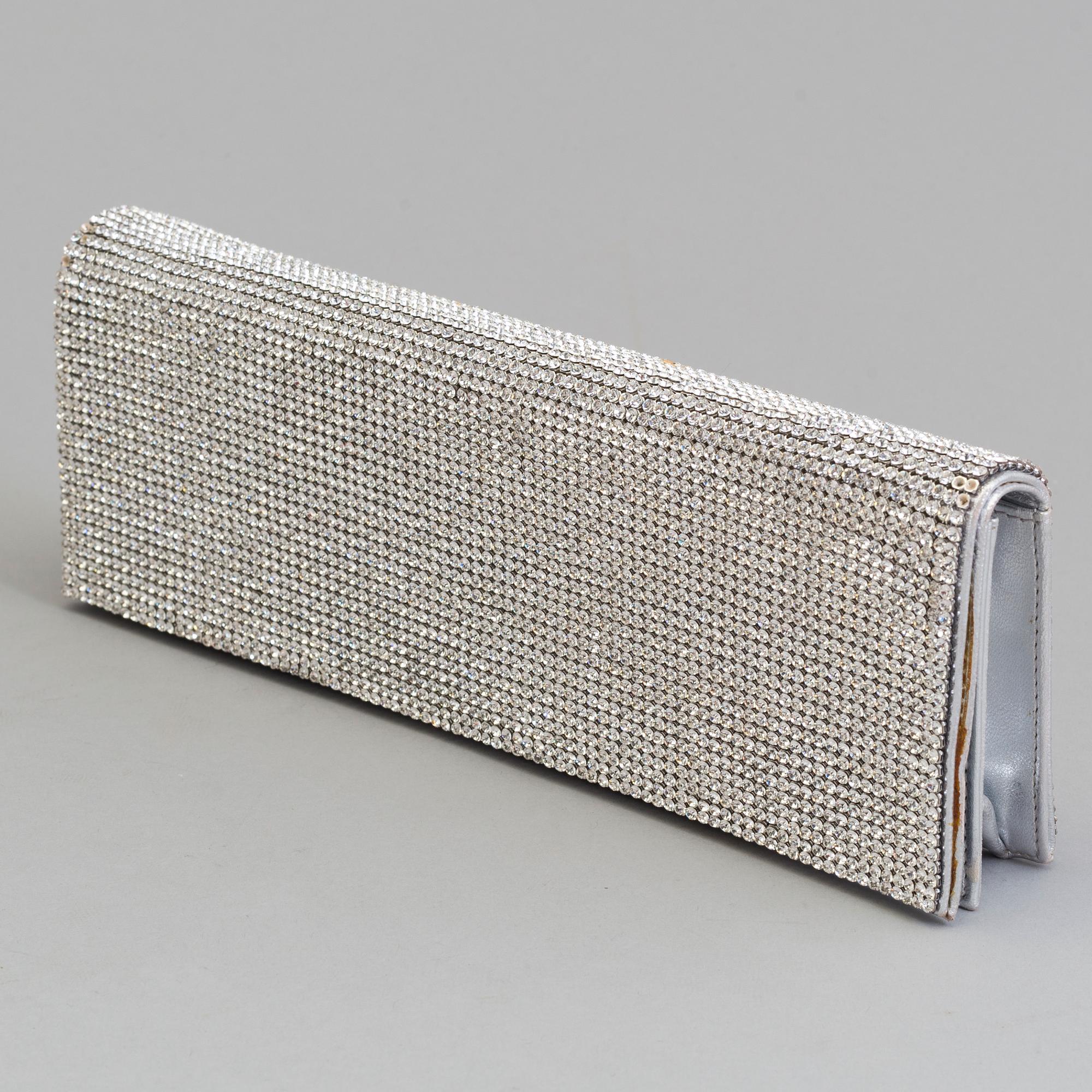 A silver- and glasstone clutch by Rene Caovilla.