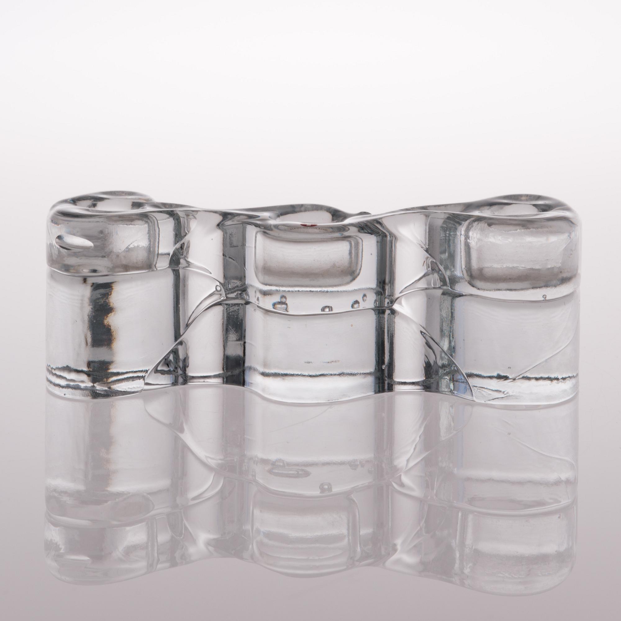 A glass sculpture / a set of three candlesticks, the Archipelago series. Signed Timo Sarpaneva.