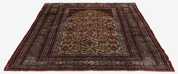 A semi-antique silk Qum rug, central Persia 221 x 138 cm.