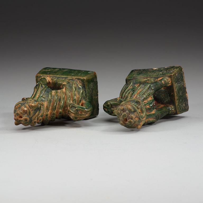A pair of green glazed joss stick holders, Ming dynasty (1368-1644).