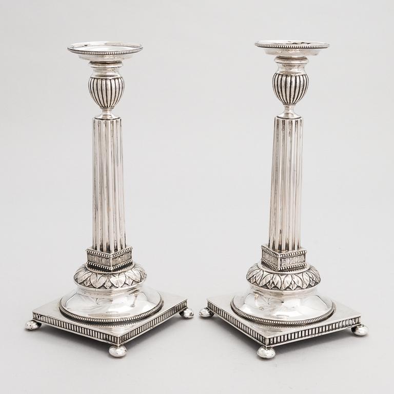 A pair of Swedish silver candlesticks, CG Hallberg, Stockholm 1901 and 1902.