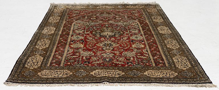 A silk Qum rug, c. 172 x 105 cm.