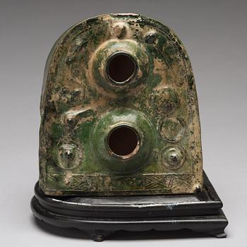 A green glazed pottery model of a stove, Han dynasty (206 BC-220 AD).