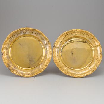 A set of nine silver-gilt sterling plates, Mexico 20th century. Rococo-style.