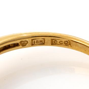 18K gold ring with a sapphire and brilliant-cut diamonds.