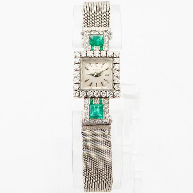 Gübelin bracelet watch in 950 platinum with round brilliant-cut and single-cut diamonds as well as step-cut emeralds.
