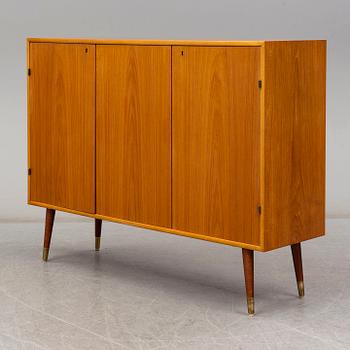 A late 20th Century teak veneered sideboard.