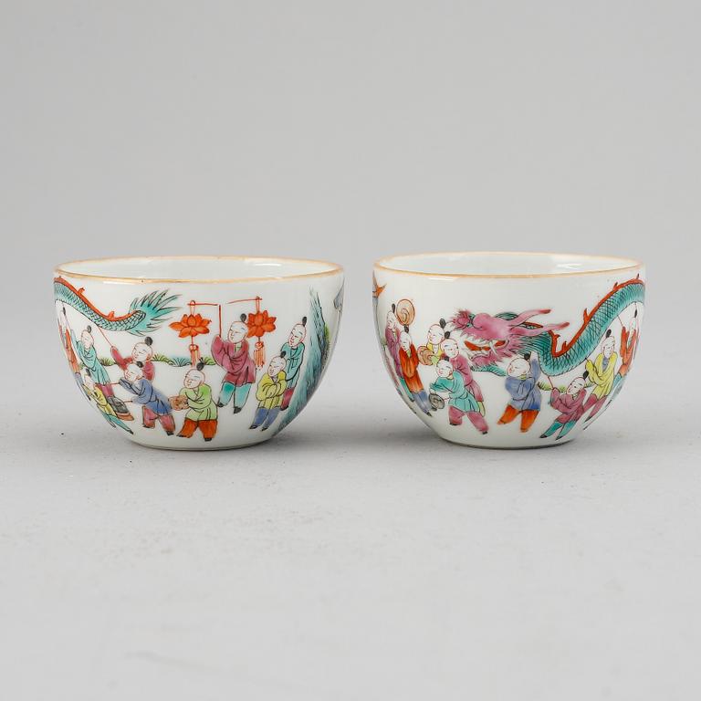 A pair fo famille rose "boys" cups, Qing dynasty late 19th Century.