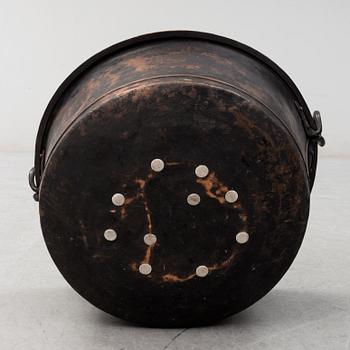 A 19th century copper cauldron.