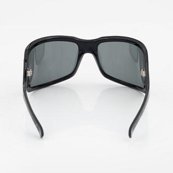 Bottega Veneta, a pair of sunglasses.