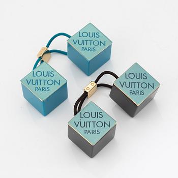 Louis Vuitton, a pair of hairties.