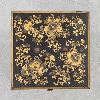 A lacquered end table/box with stand, Japan, 20th century.