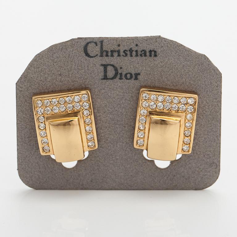 Christian Dior, A pair of gold coloured metal earrings with rhinestones. Marked Chr. Dior, Germany.