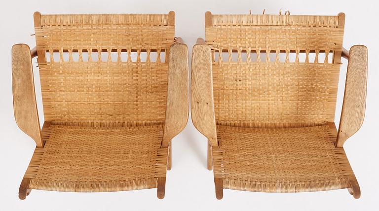 Hans J. Wegner, a pair of oak and rattan 'CH27' chairs, Carl Hansen & Søn, Odense Denmark 1950s-1960s.