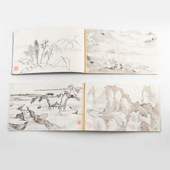 Two Chinese books with ink wash paintings, two ink drawings on paper, artists seals Hu Xihe and Na Wufu, 20th century.