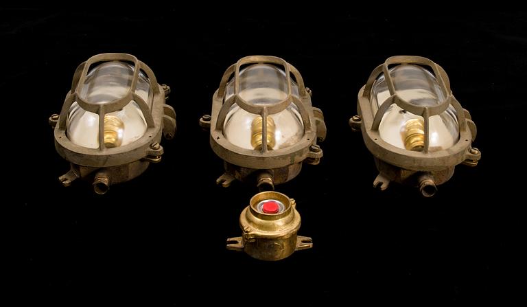 A set of three lights and a switcher from the latter half of the 20th century.