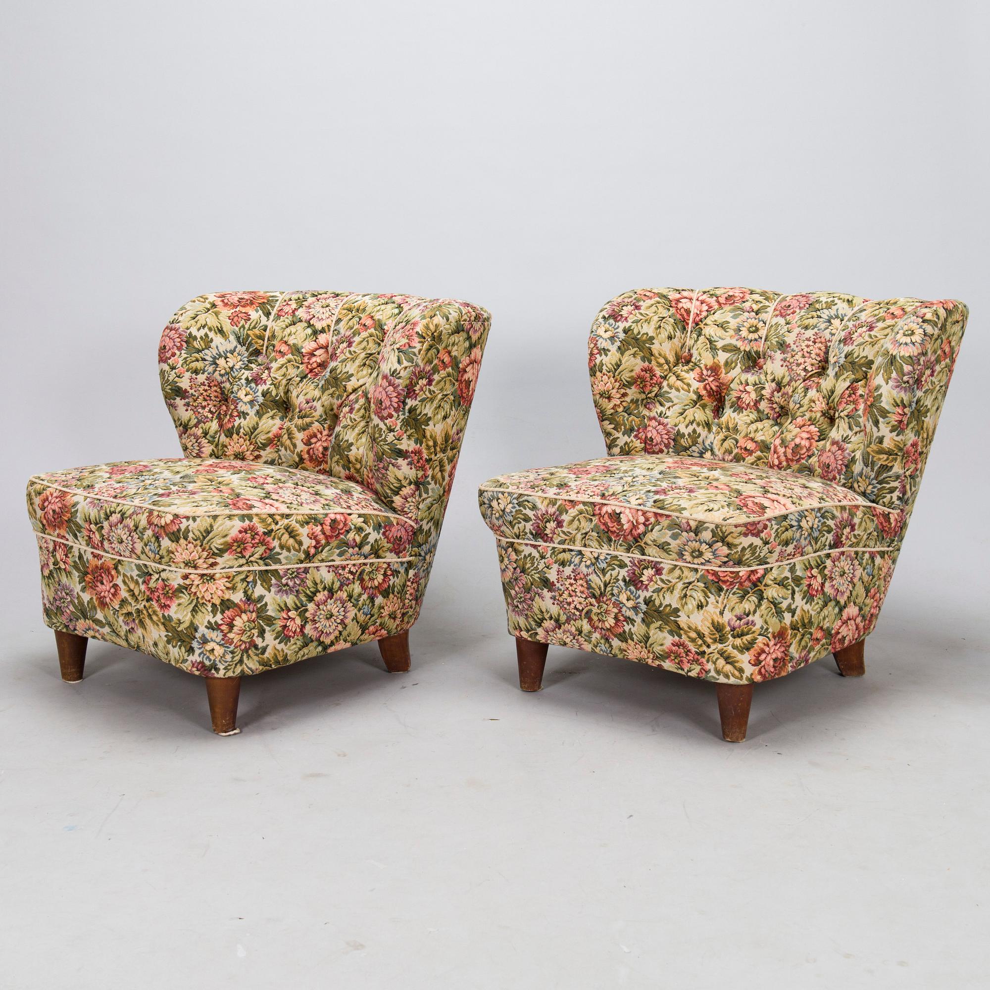 A pair of mid-20th-century armchairs.
