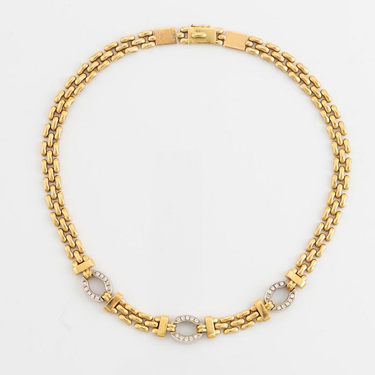 18K gold and round brilliant cut diamond necklace.