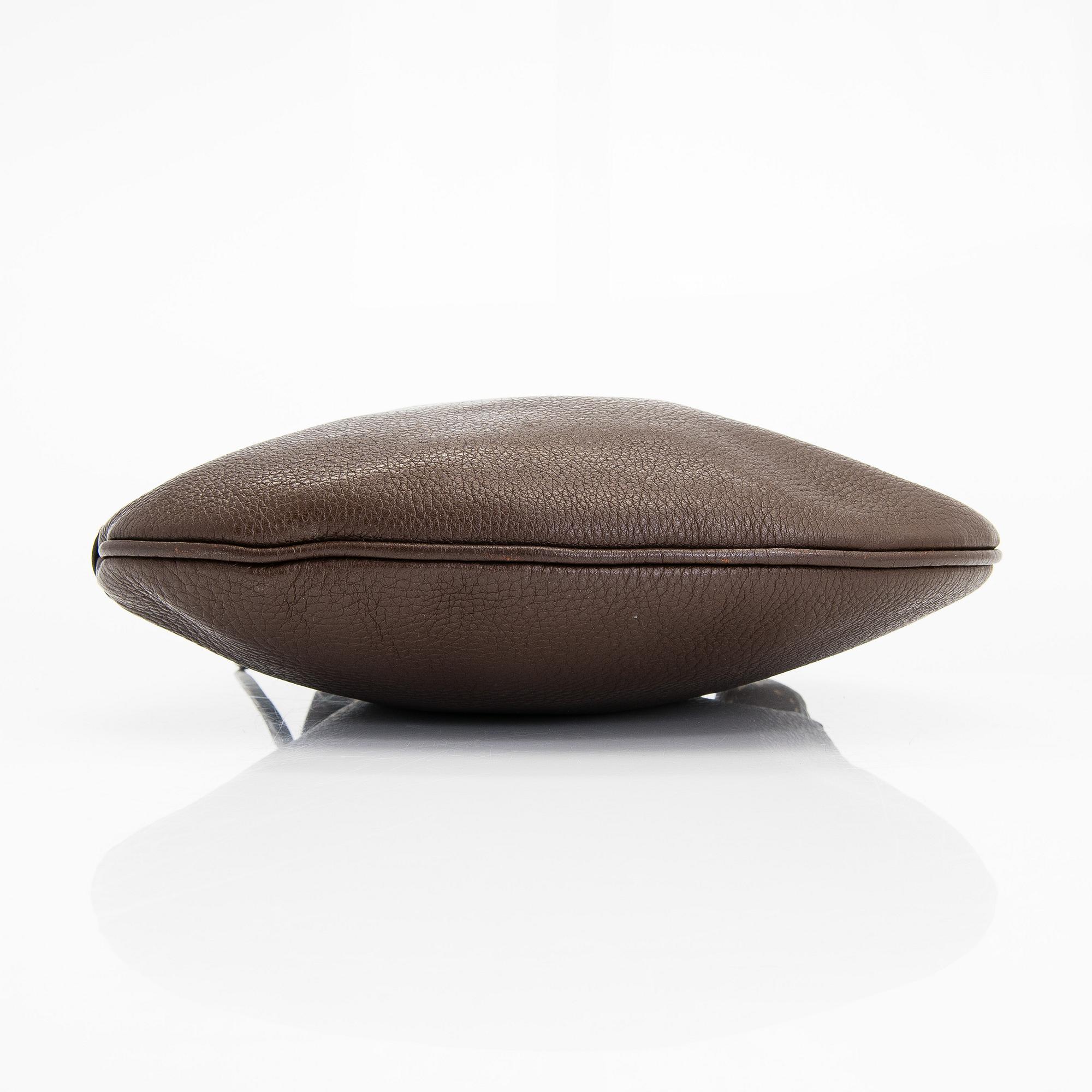 Fendi, a brown leather bag.