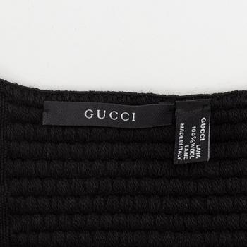 Gucci, a black wool scarf.