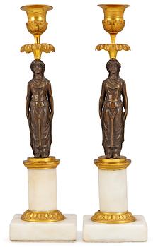1035. A pair of late Gustavian candlesticks.